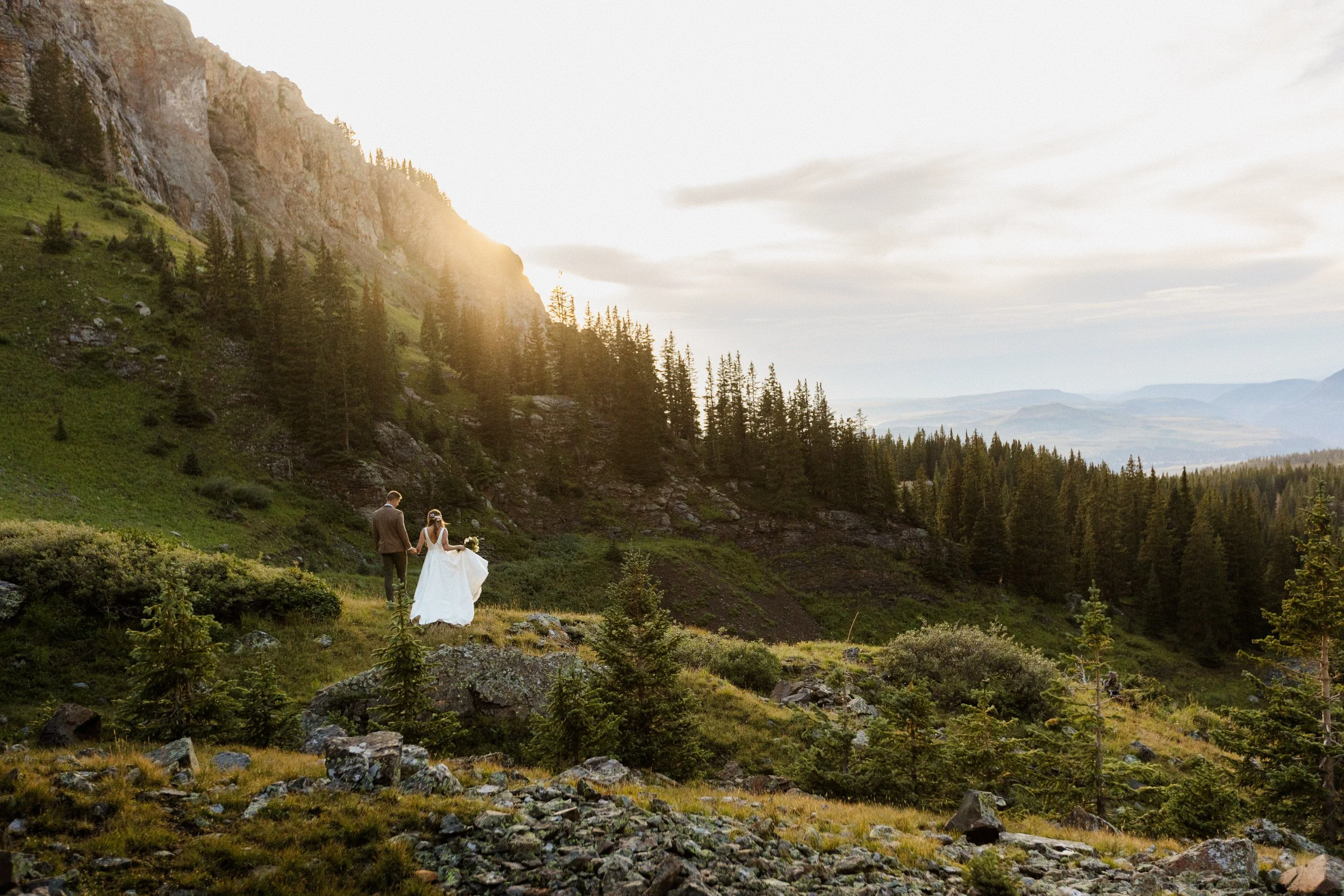 Couple standing together in the San Juan Mountains above Telluride, Colorado during their jeep elopement