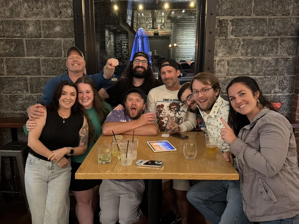 A trivia team around their table on a Classy Cat night
