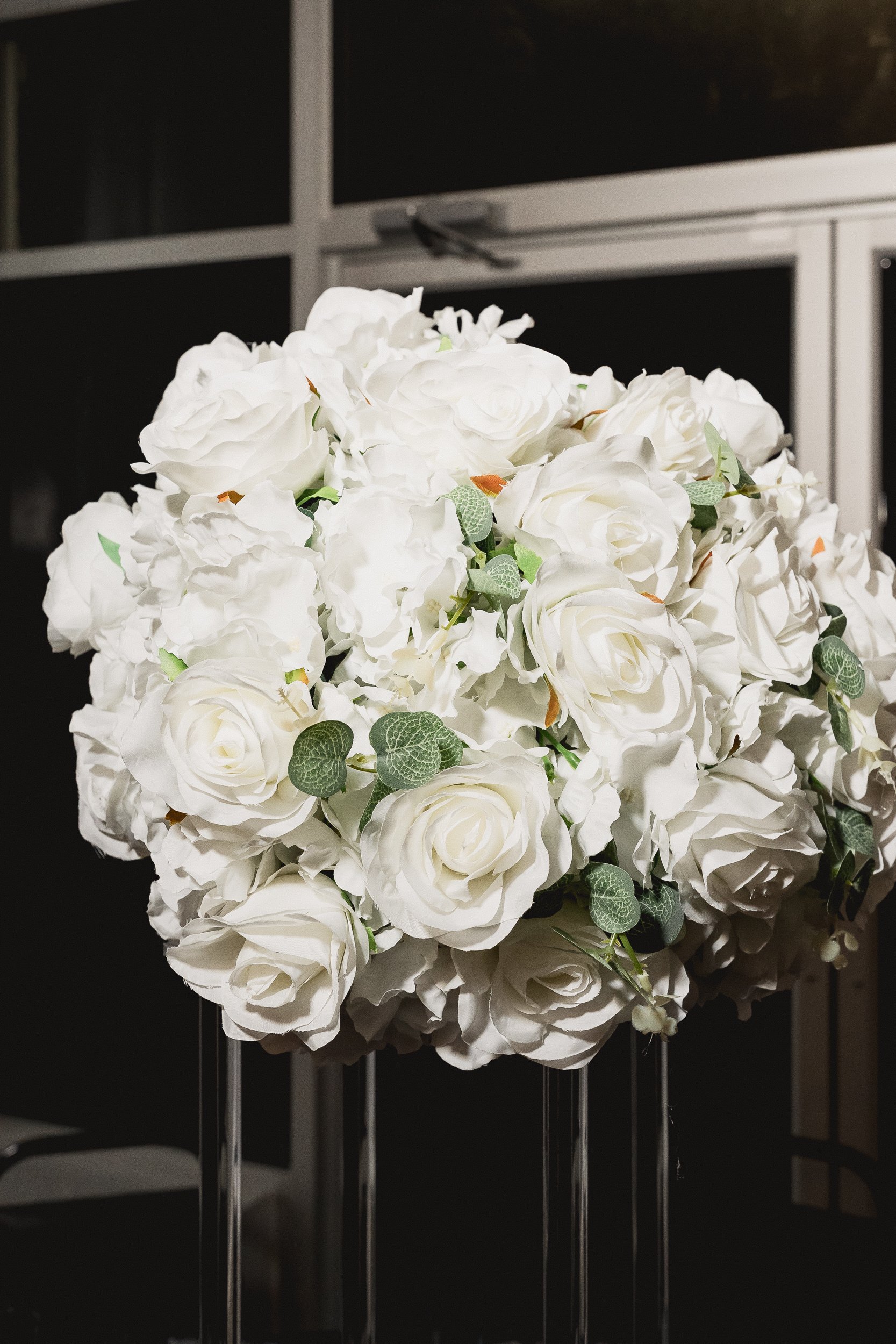 White floral centerpiece at the reunion.