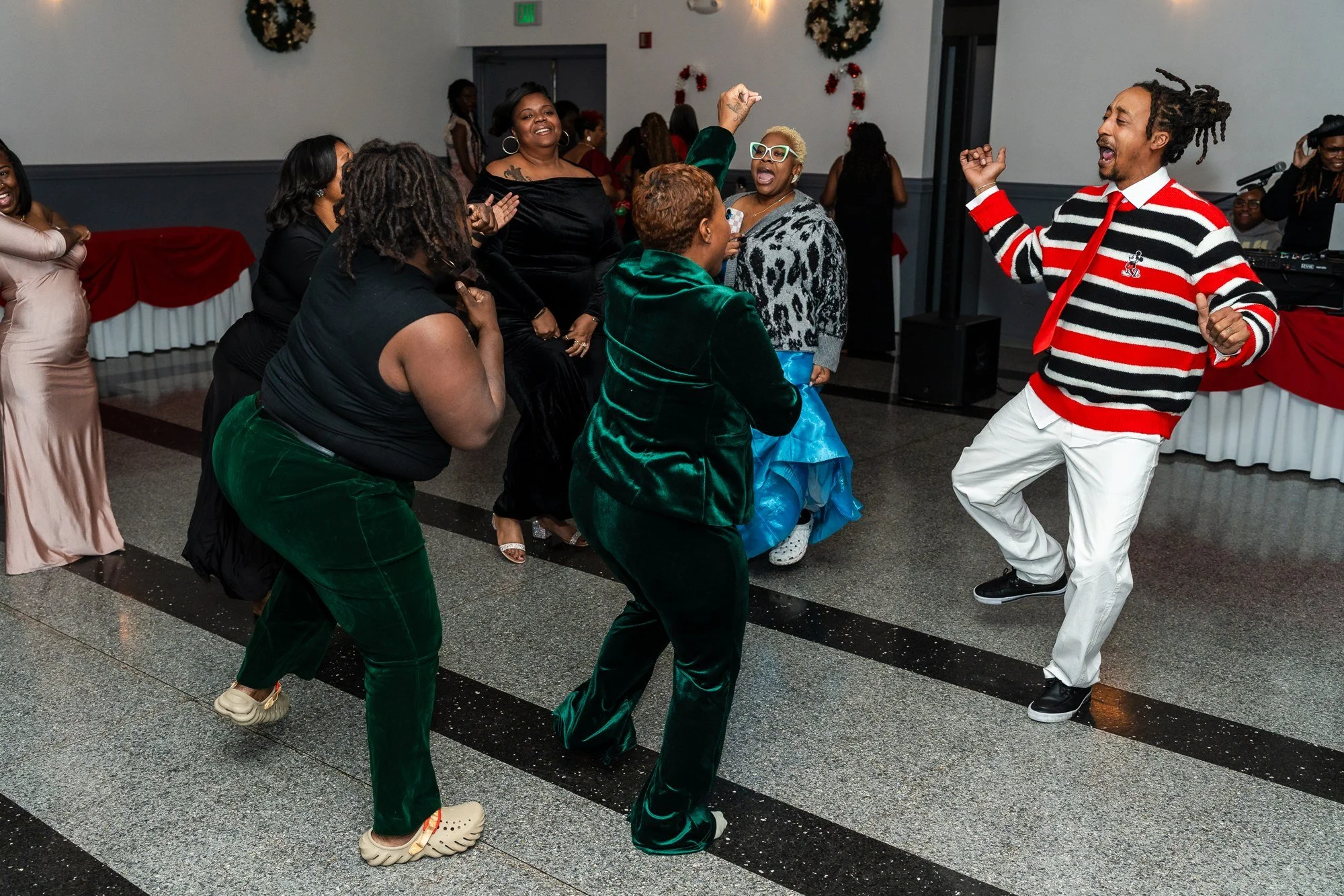 Guests enjoying the dance floor at the Kidz Stuff holiday party