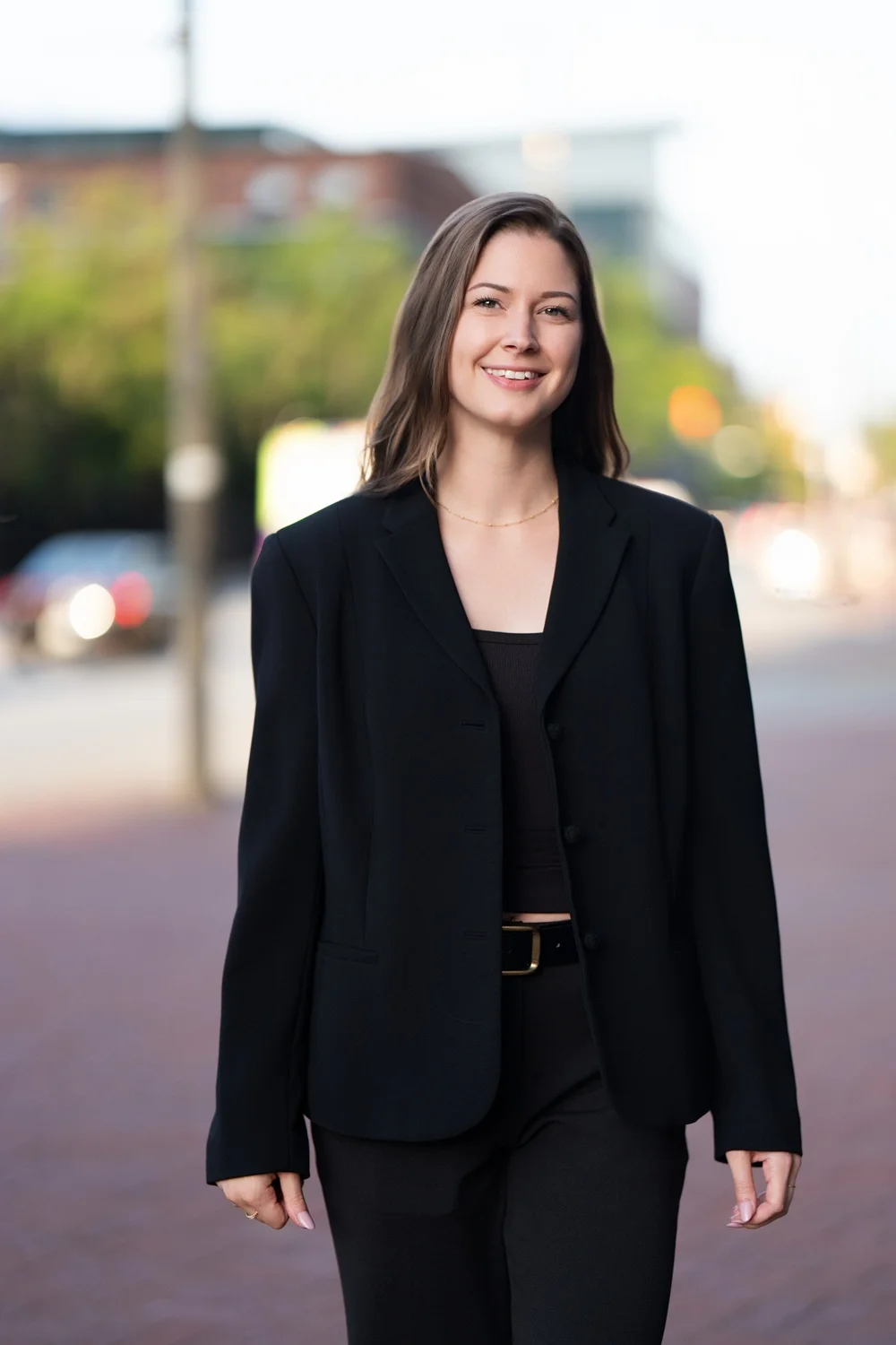 Sam Rodgers in a black blazer on a Baltimore street