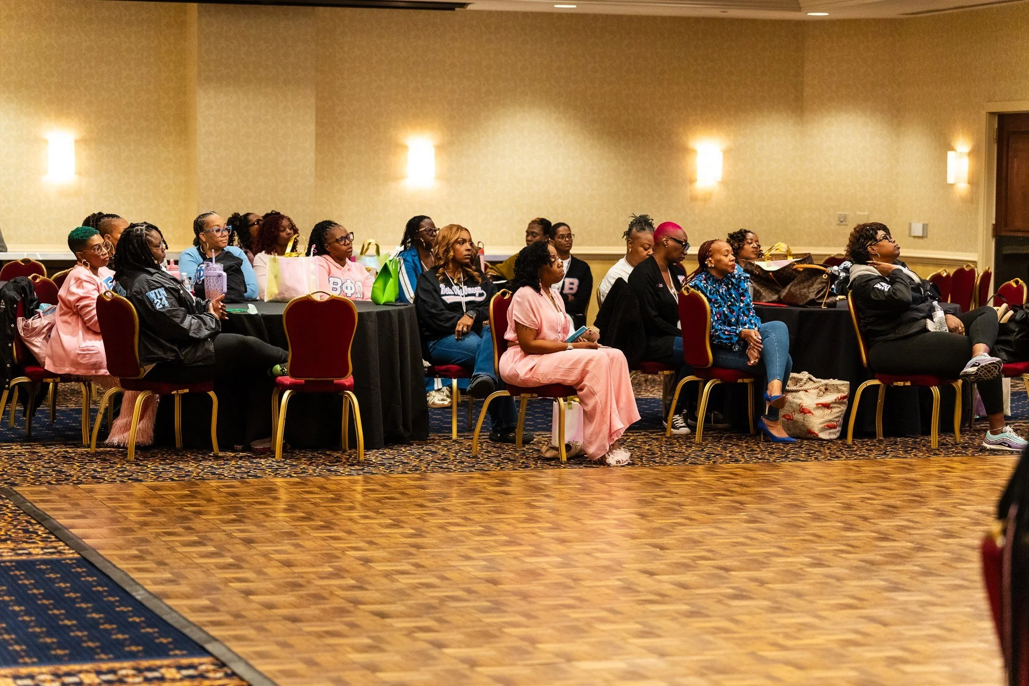 Guests seated at round tables during a ballroom event