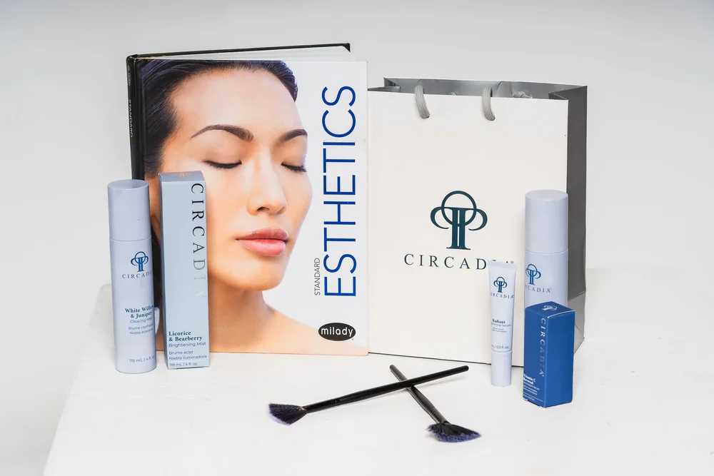 Circadia beauty products, an esthetics textbook and brushes from the DuoGlo branding session