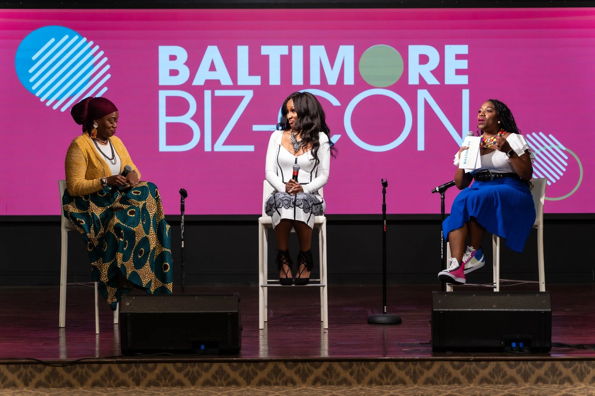 Three speakers participating in a Baltimore Biz-Con panel discussion