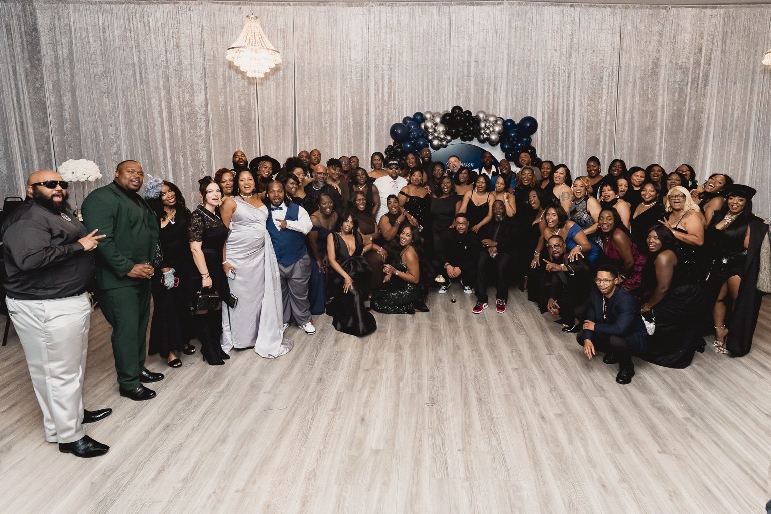 The reunion guests gather for a celebratory class portrait.