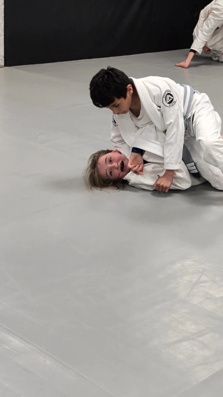 Young RGA Leicester students practising Gi grappling on the mats