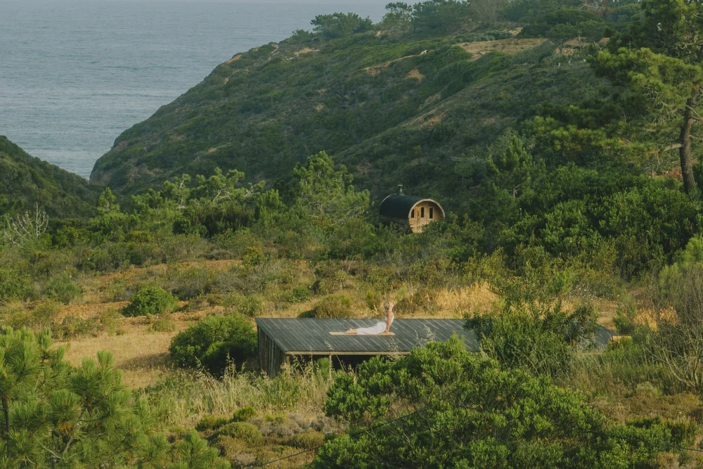Morning movement practice on Amaria’s outdoor deck above a coastal valley and the Atlantic near Odeceixe, Portugal