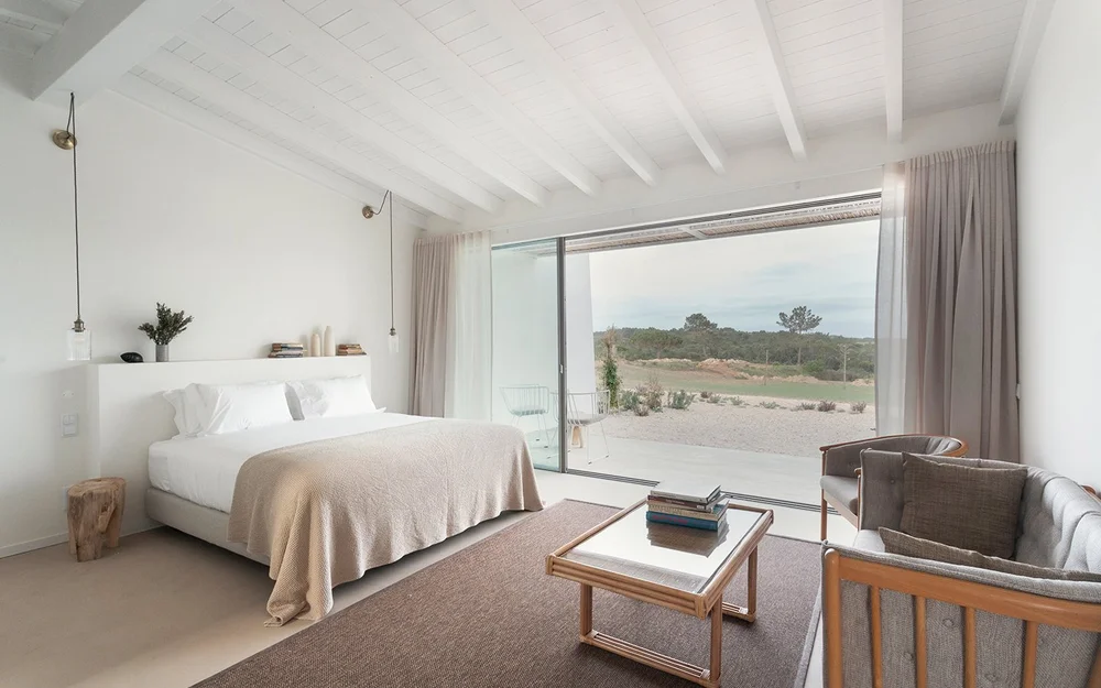 Farmhouse Suite 4 bedroom with seating and a wide landscape window at Amaria