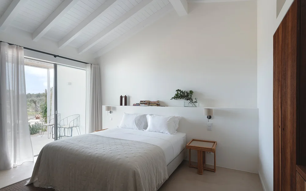 Junior Suite 2 bedroom with natural light beside the terrace window at Amaria