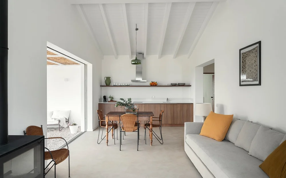 Apartment kitchen, dining table and living area at Amaria