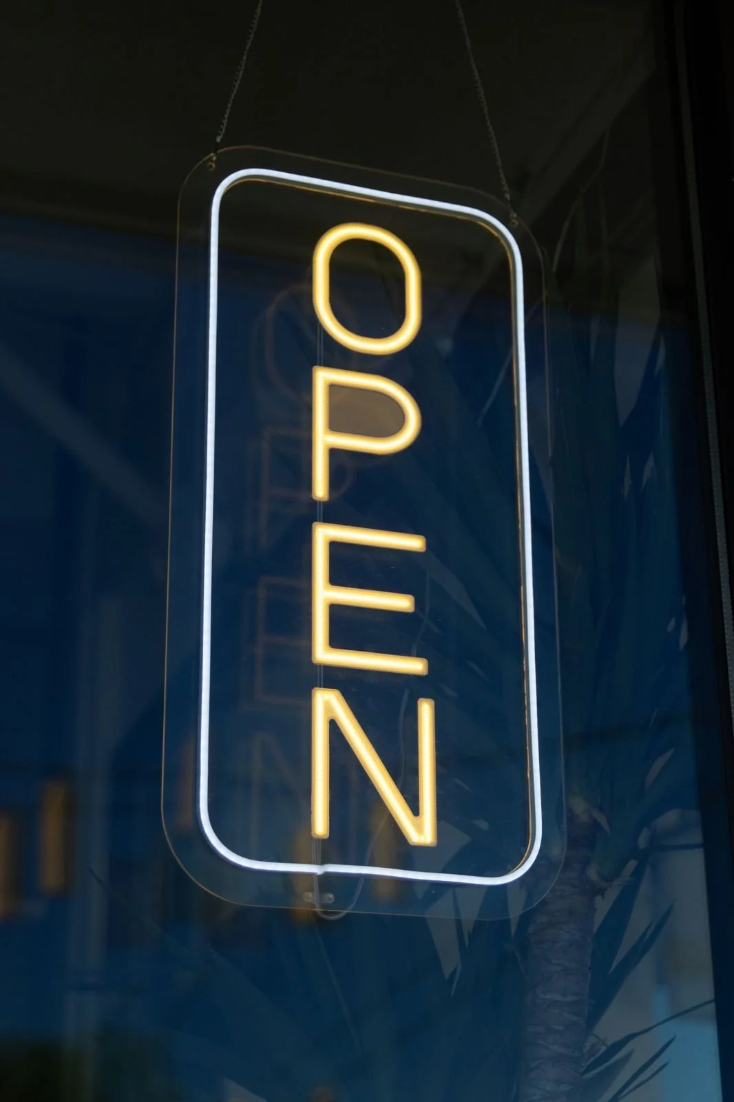 Neon OPEN sign in the Ola window