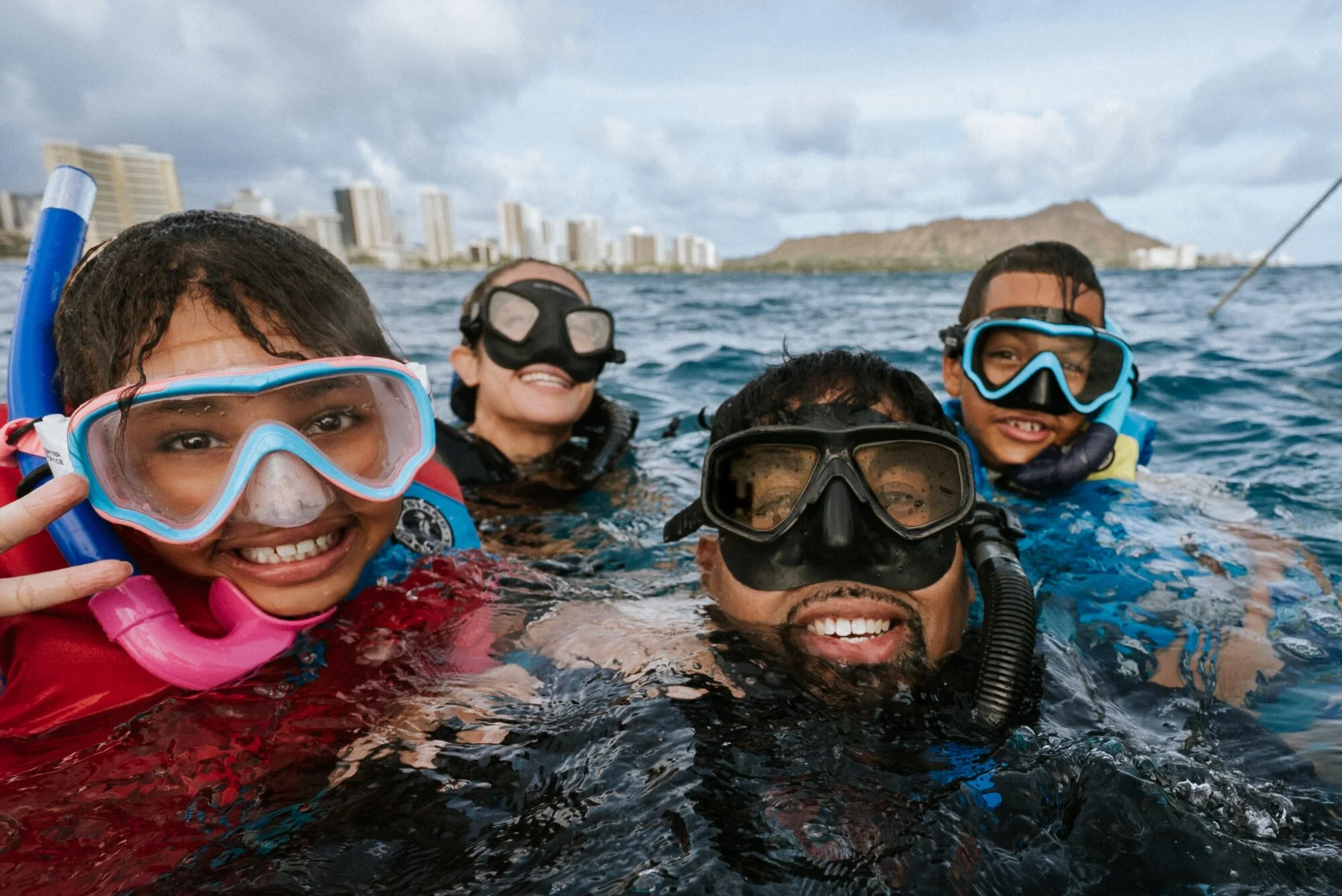Nick snorkeling with his family off Waikiki