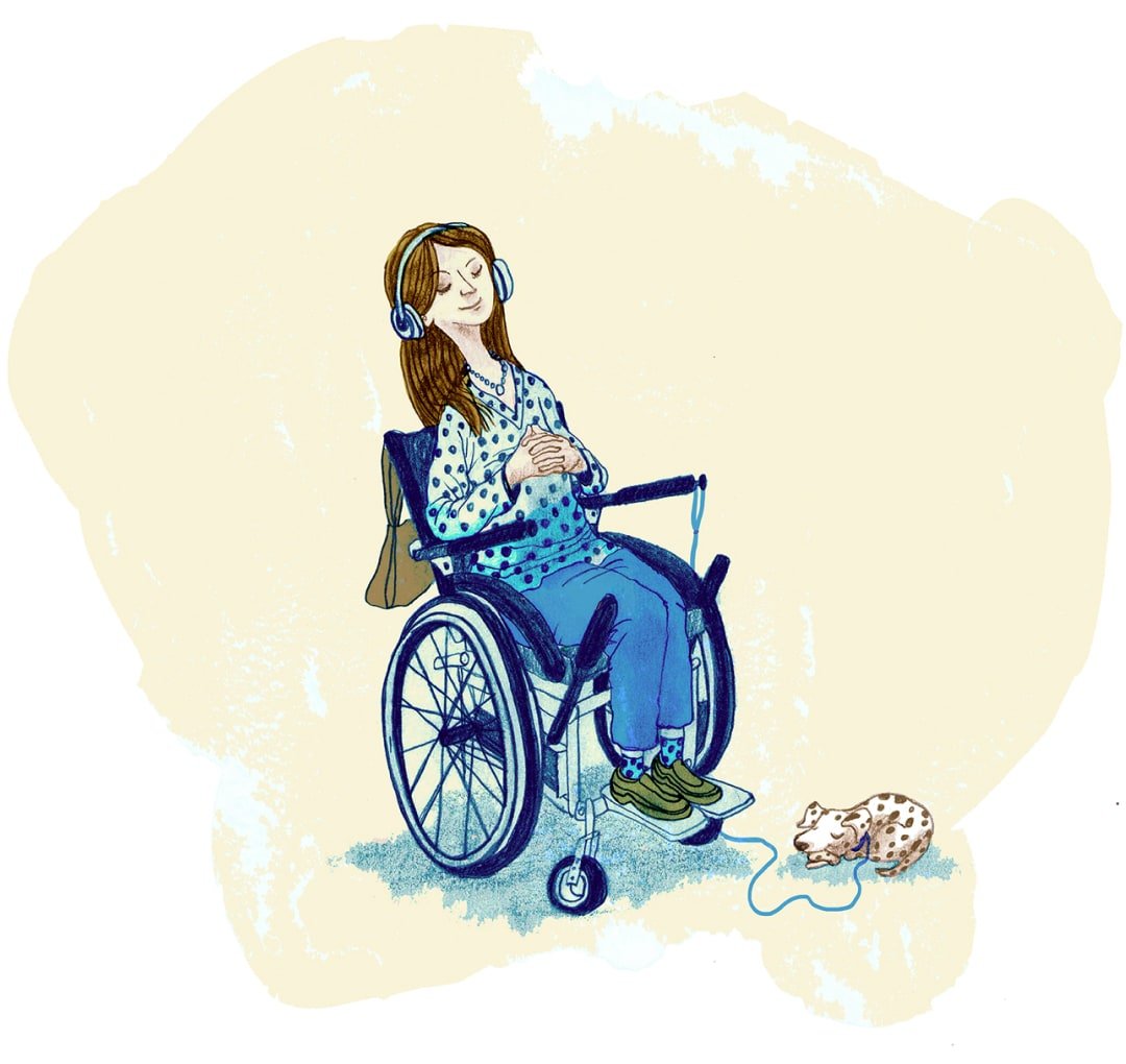 A woman sits peacefully in a wheelchair. She is wearing headphones. Her eyes are closed. A spotty dog sits at her feet, asleep.