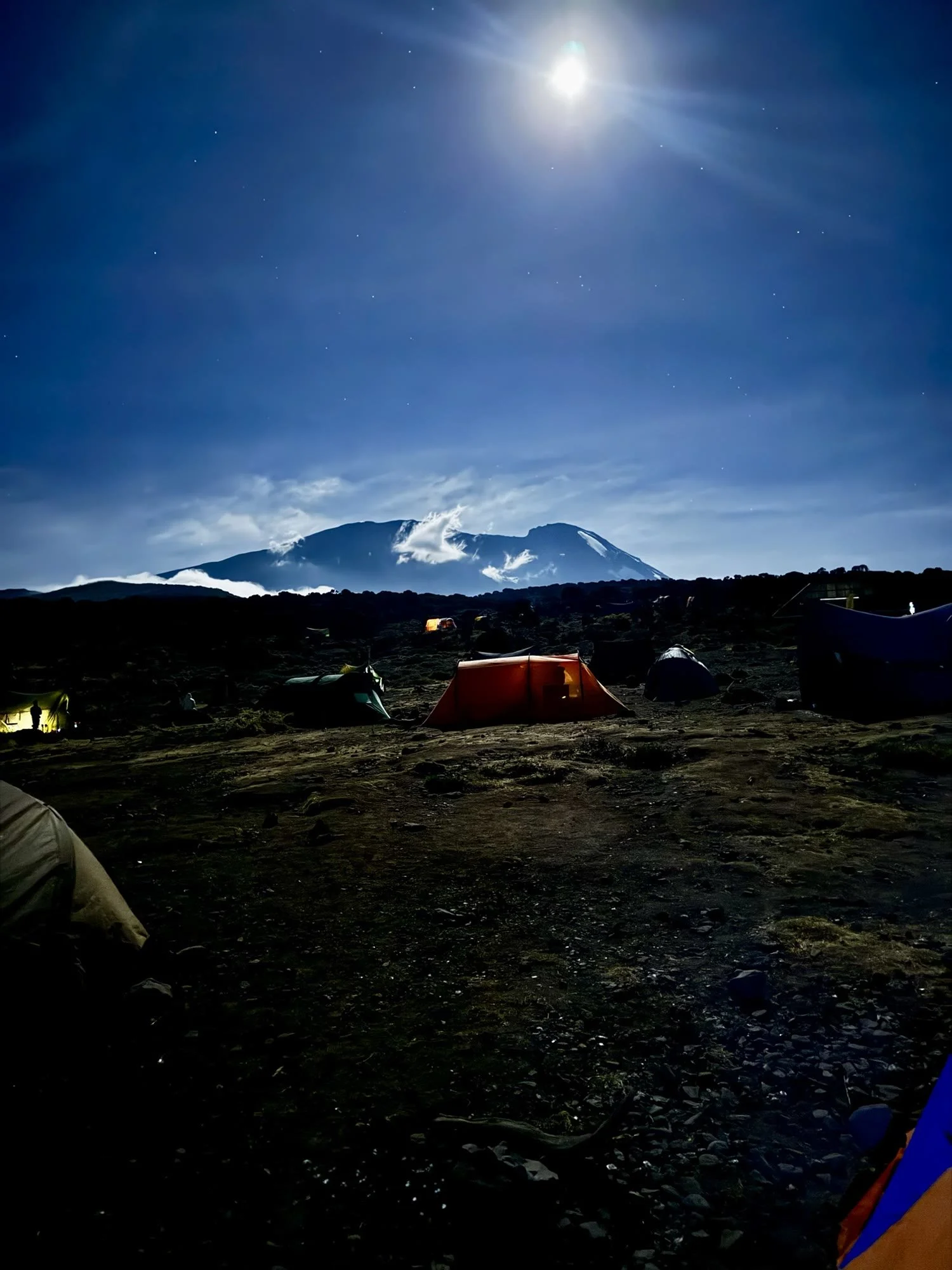 The mountain lit by moonlight above our tents at night