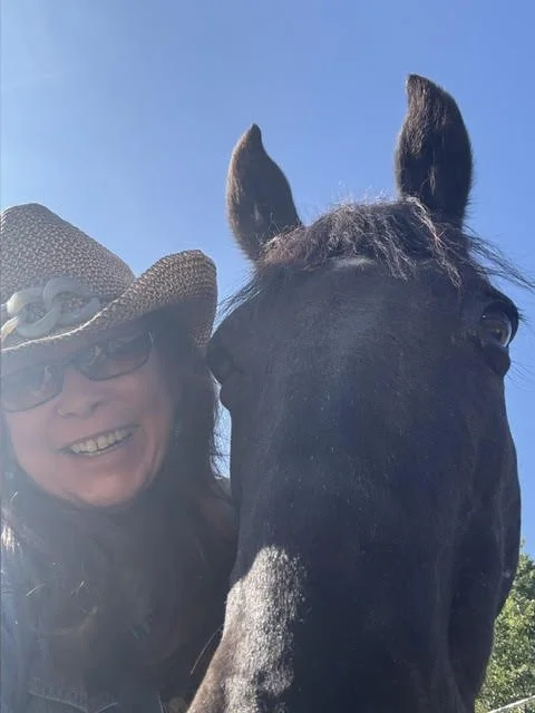 Amita with Butte, the horse she rescued