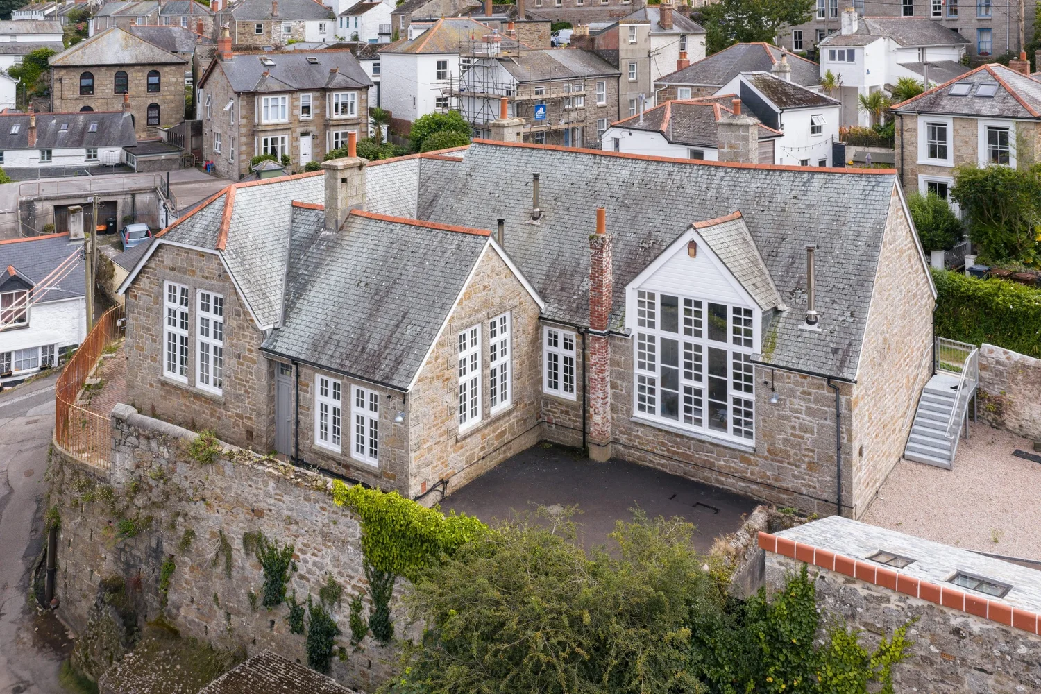 Aerial view of the former school building at Trewarveneth Studios, Newlyn, Cornwall