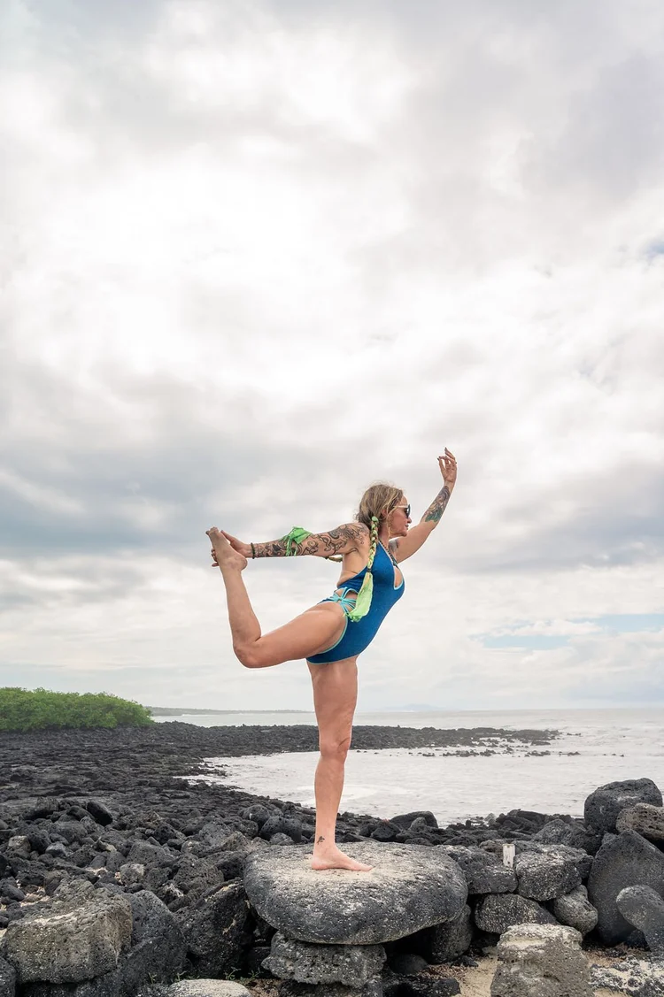 Yoga on the beach on a Galápagos yoga retreat