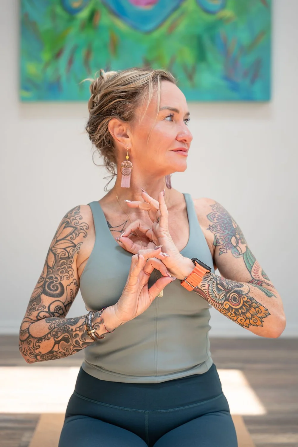 Shelley Carroll, founder of DDY Travels, with hands in prayer, host of the Temple Rebellion yoga retreat in Cambodia