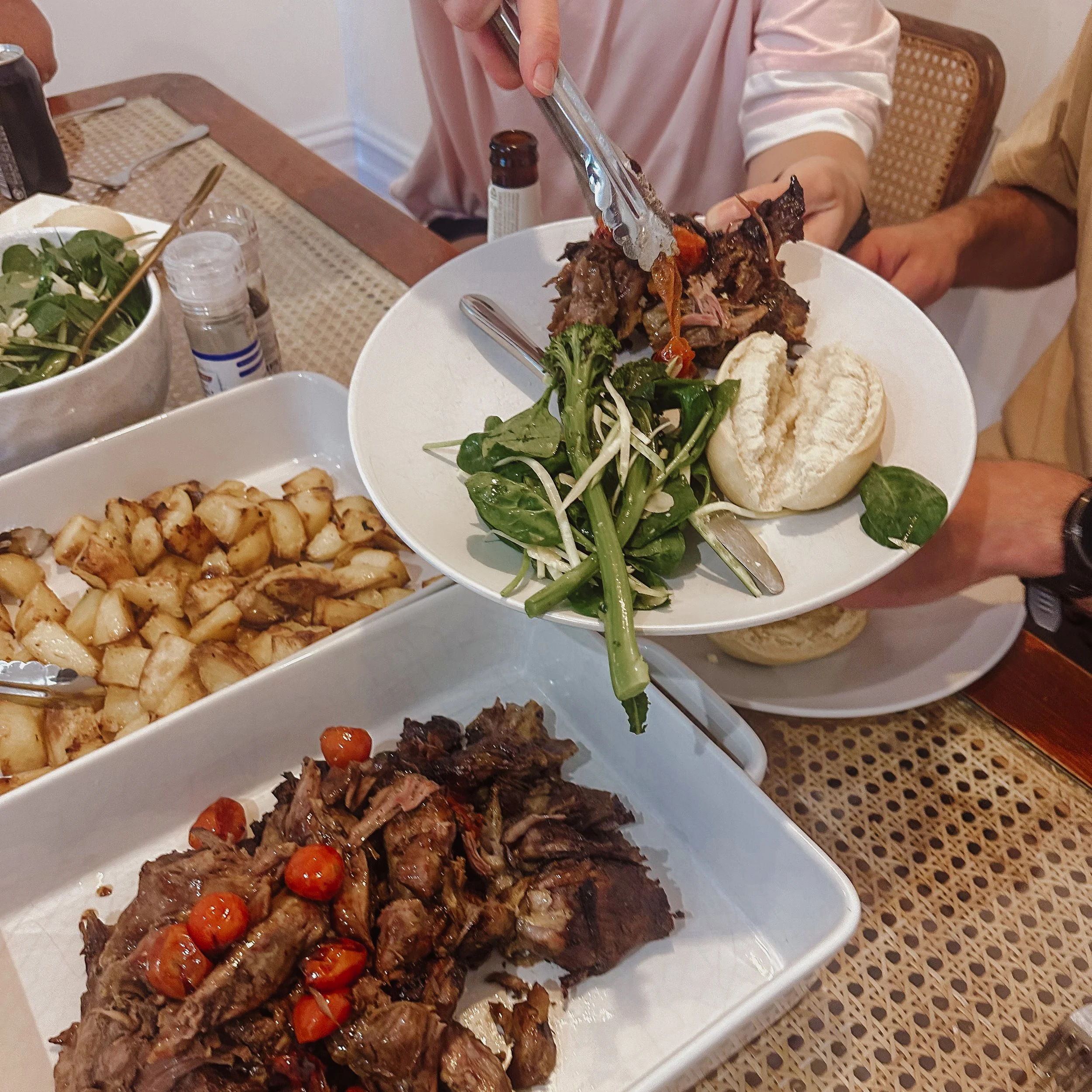 Plated Build Your Own meal with roasted meat, salad and bread at a Wyton dinner table