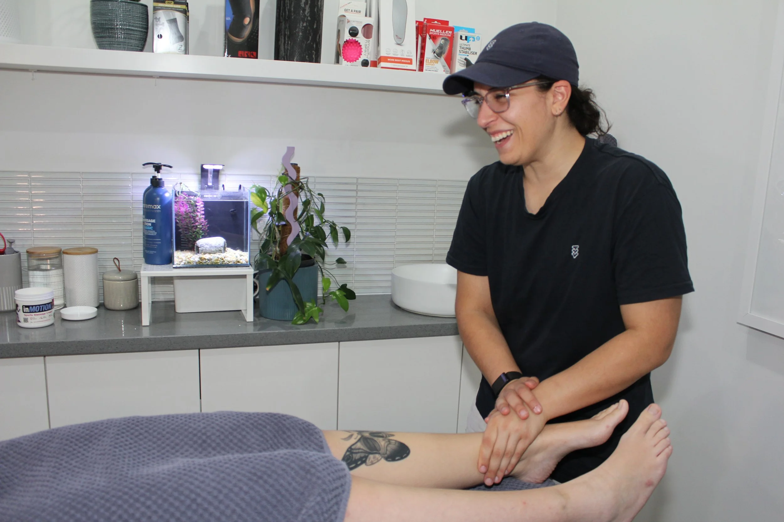 Osteopath assessing a patient's leg at West Osteopathy