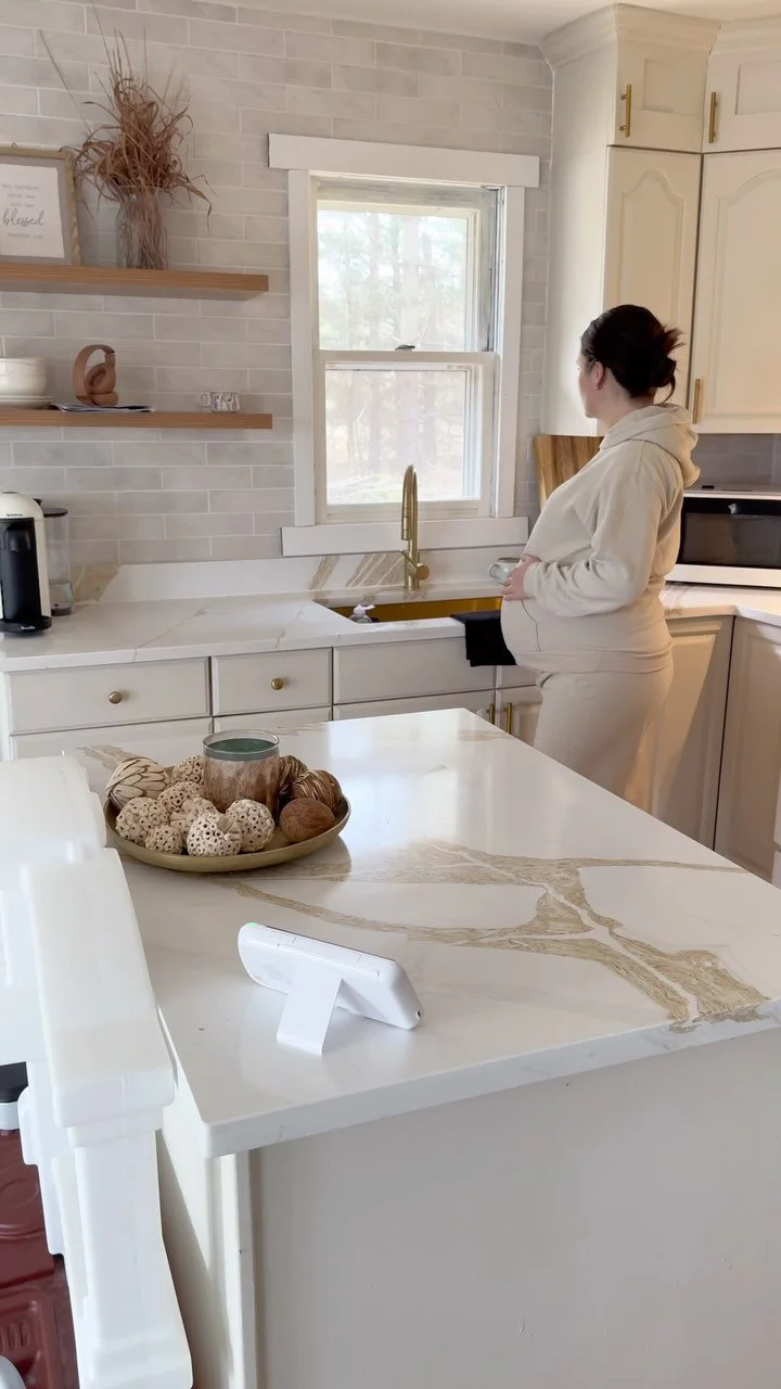 Babysense creator collaboration showing a parent in her kitchen with a baby monitor on the counter.