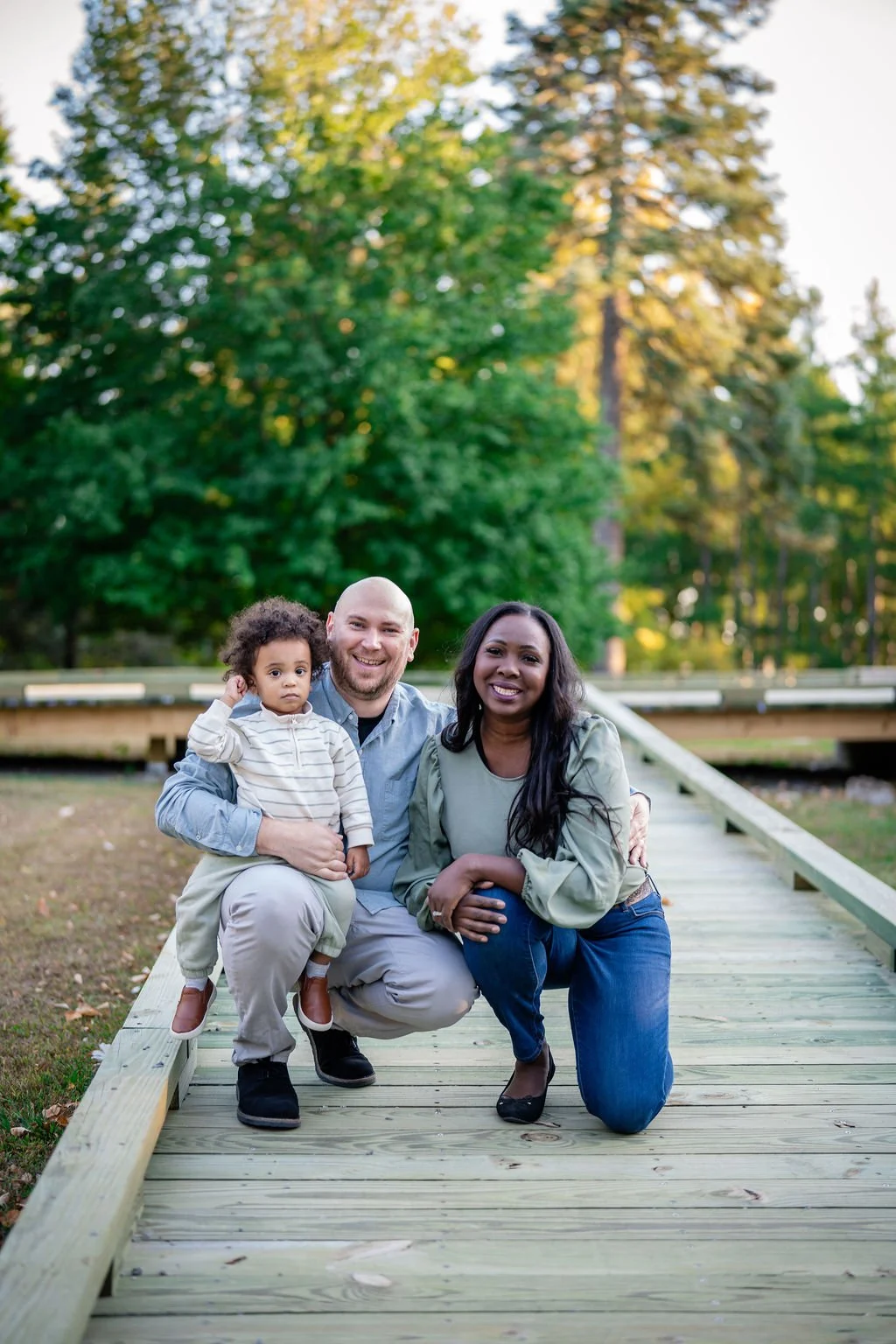 Eunice with her husband Jake and son Samuel on a boardwalk