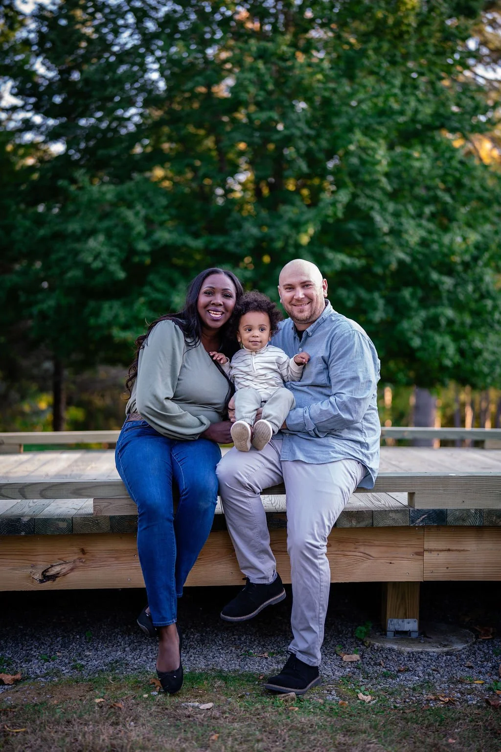 Eunice sitting on a bench with her family