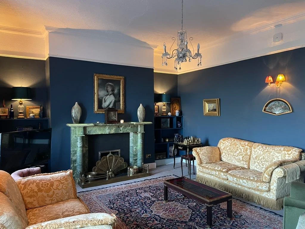 Blue sitting room and fireplace