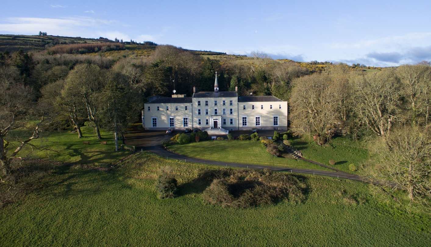 Orlagh House and its wooded grounds