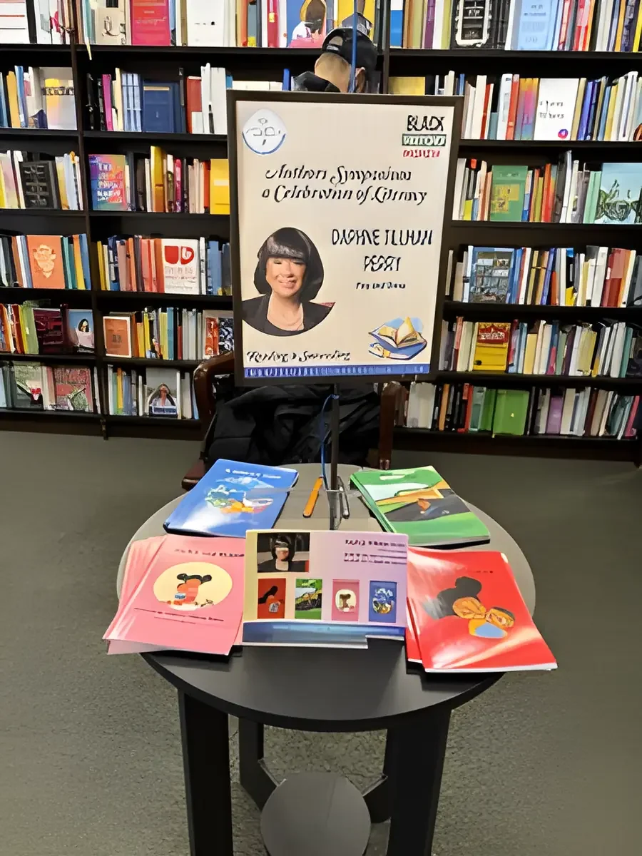 Daphne Tillman Perry’s six children’s books displayed on a table at an author event