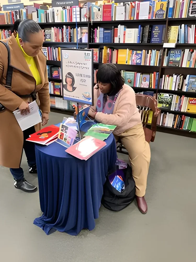 Daphne Tillman Perry signing books at a bookstore event