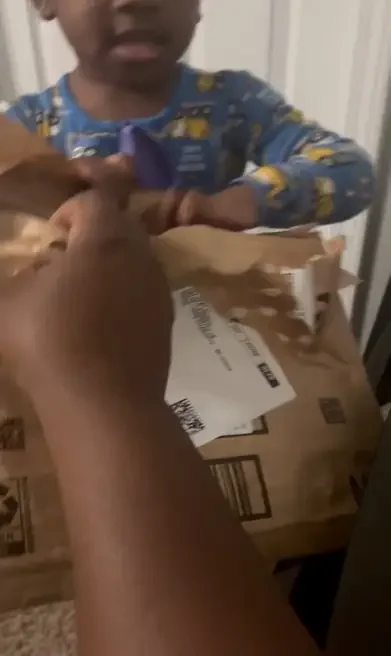 Jameson unboxing his copy of A Great Fish