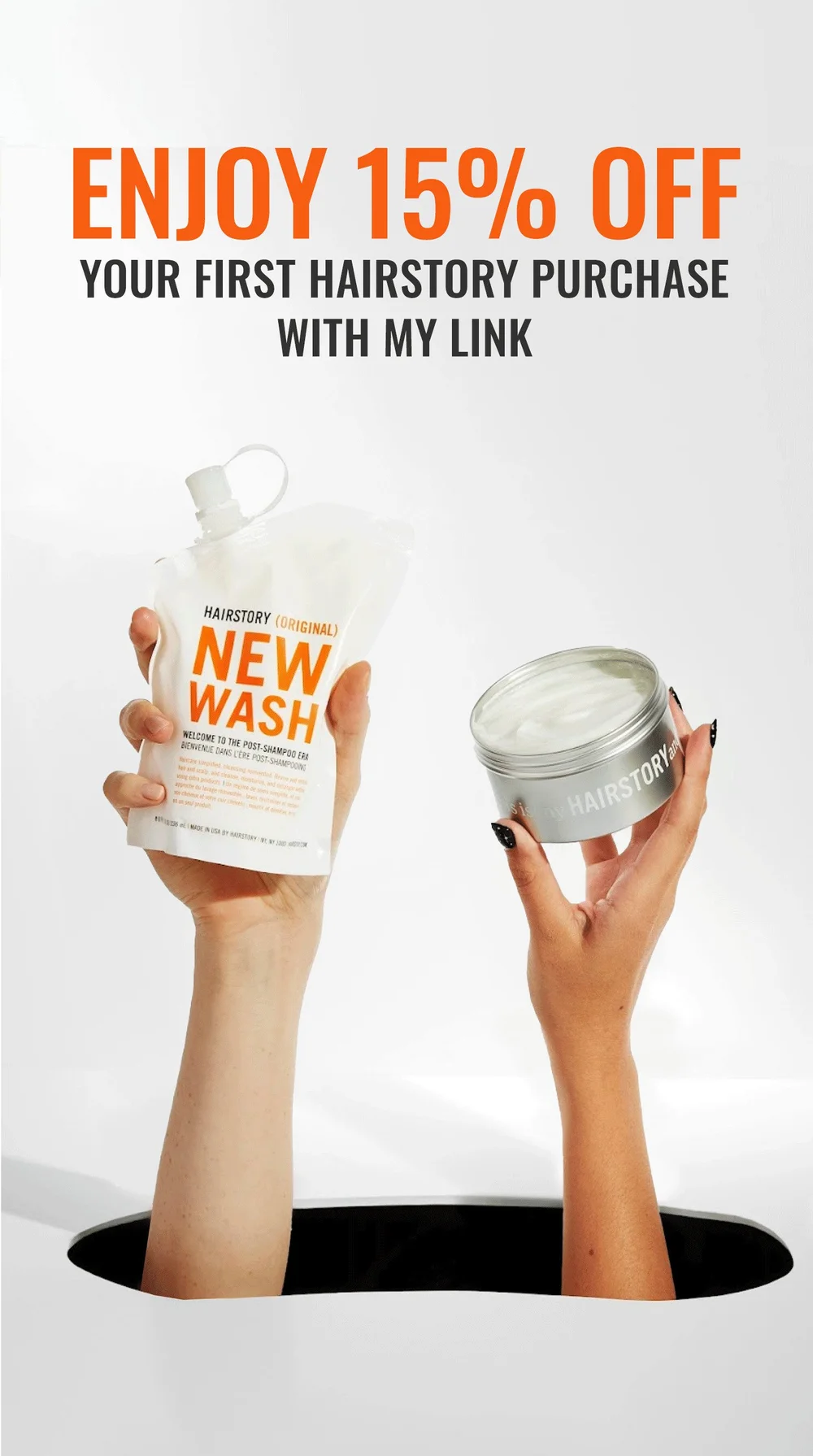 Hairstory New Wash pouch and hair balm held in two hands
