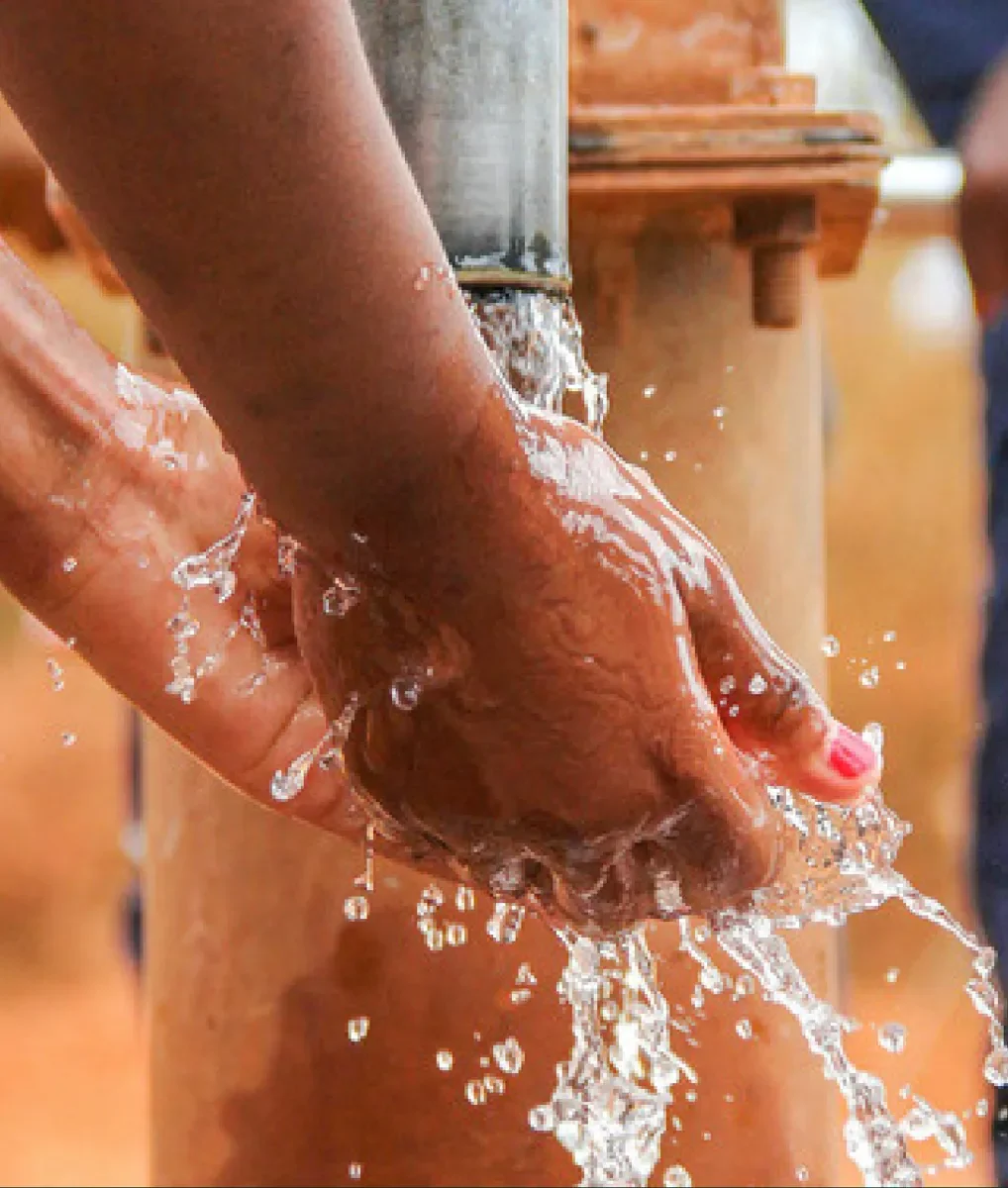 Hands catching water from a tap