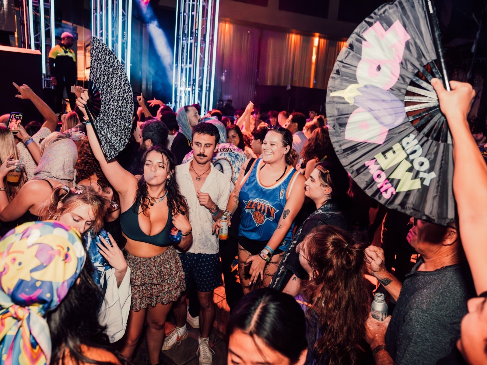 Saturday night crowd with fans and hands up at The Pool After Dark, Harrah's Atlantic City