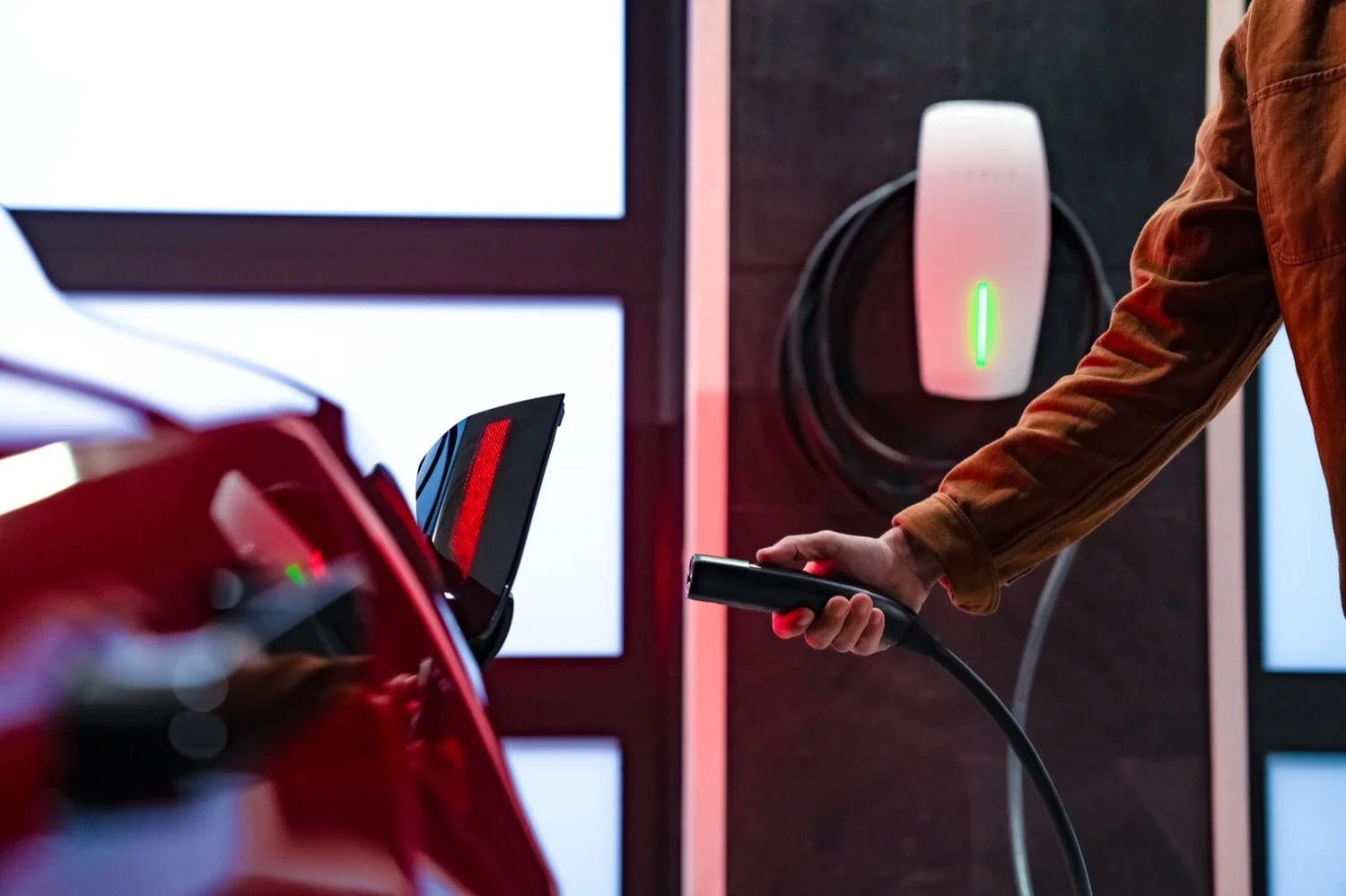 Plugging a Tesla into a Wall Connector at home