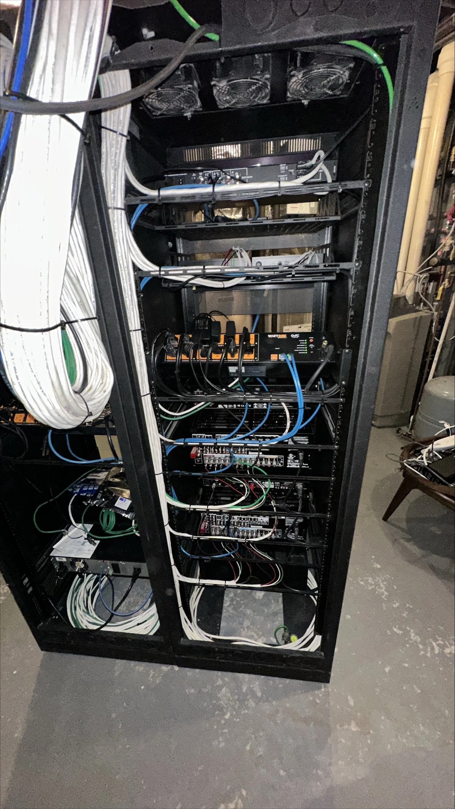 Organized back view of an AV rack with clean cabling