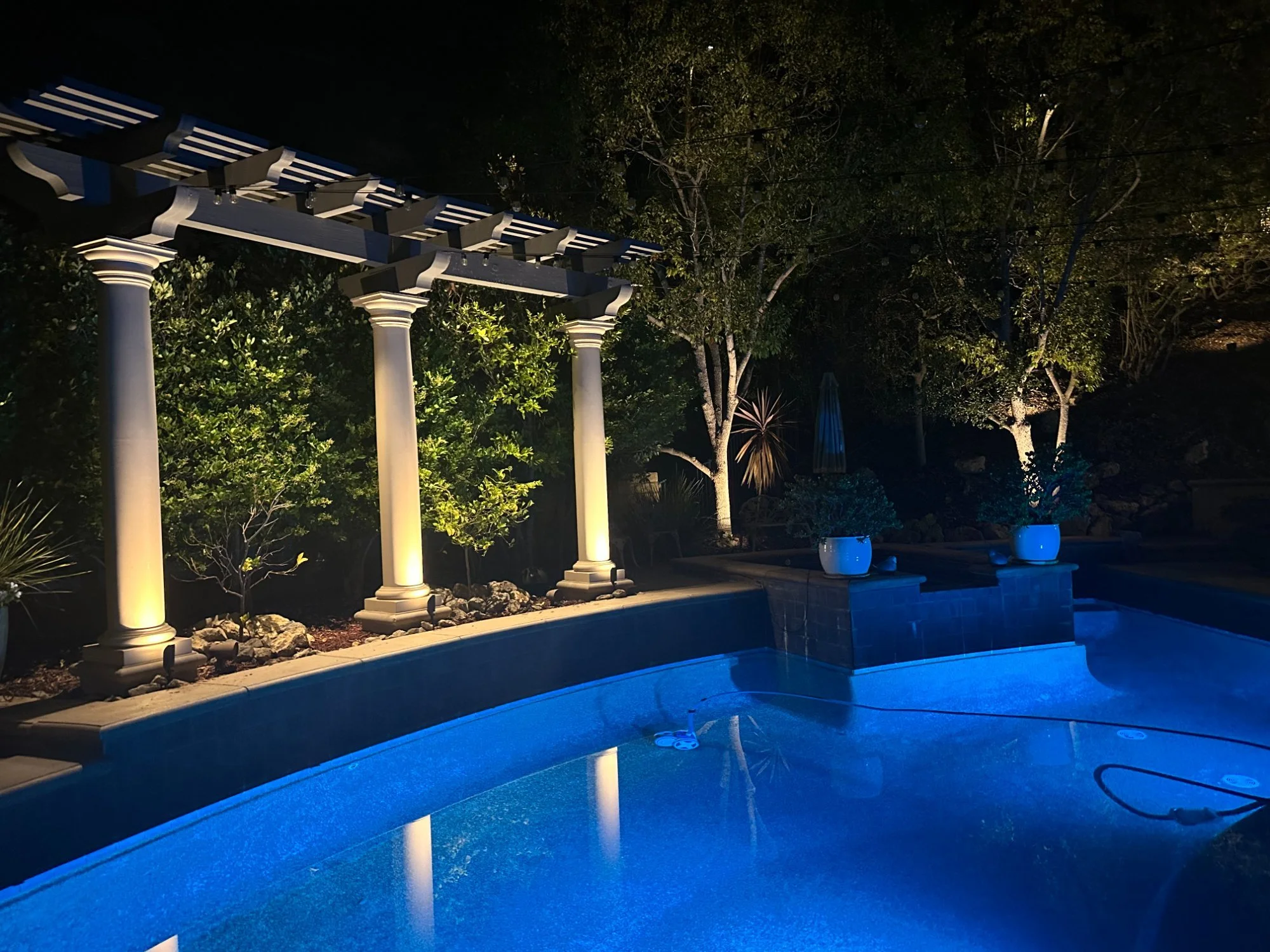 Landscape lighting pool and pergola backyard Los Angeles estate