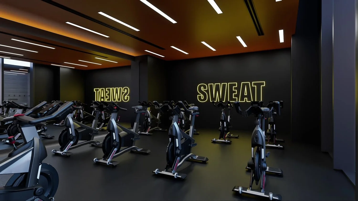 Indoor cycling studio design for a luxury apartment amenity floor