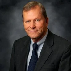 The Honorable Bruce Woodbury