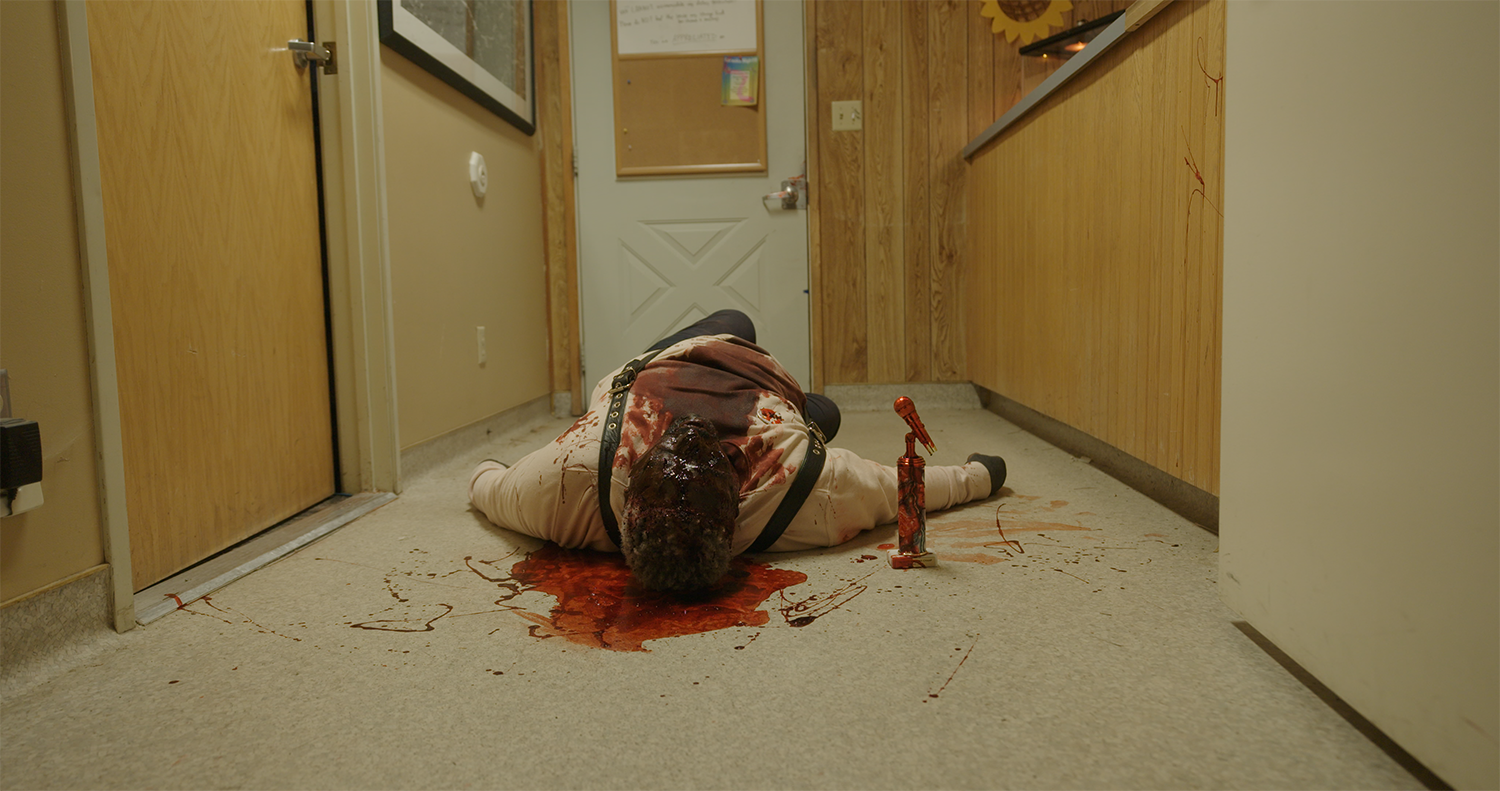 Actor lies in a bloody puddle