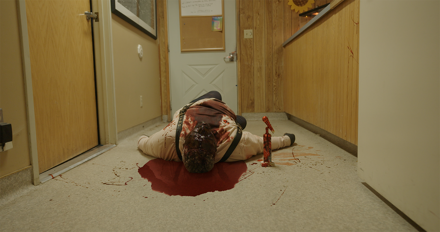 Actors lies in a bloody puddle, with VFX completed by Foxtrot X-Ray