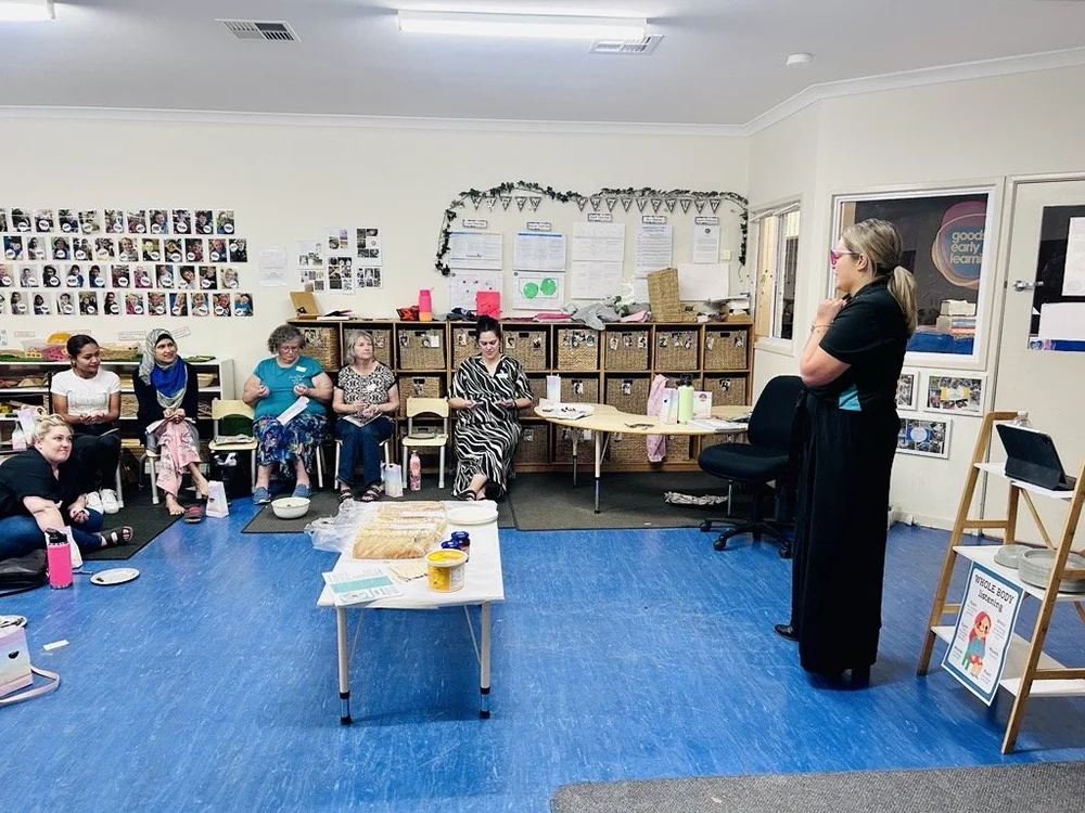 A Psychsense facilitator running a hands-on session with a small group