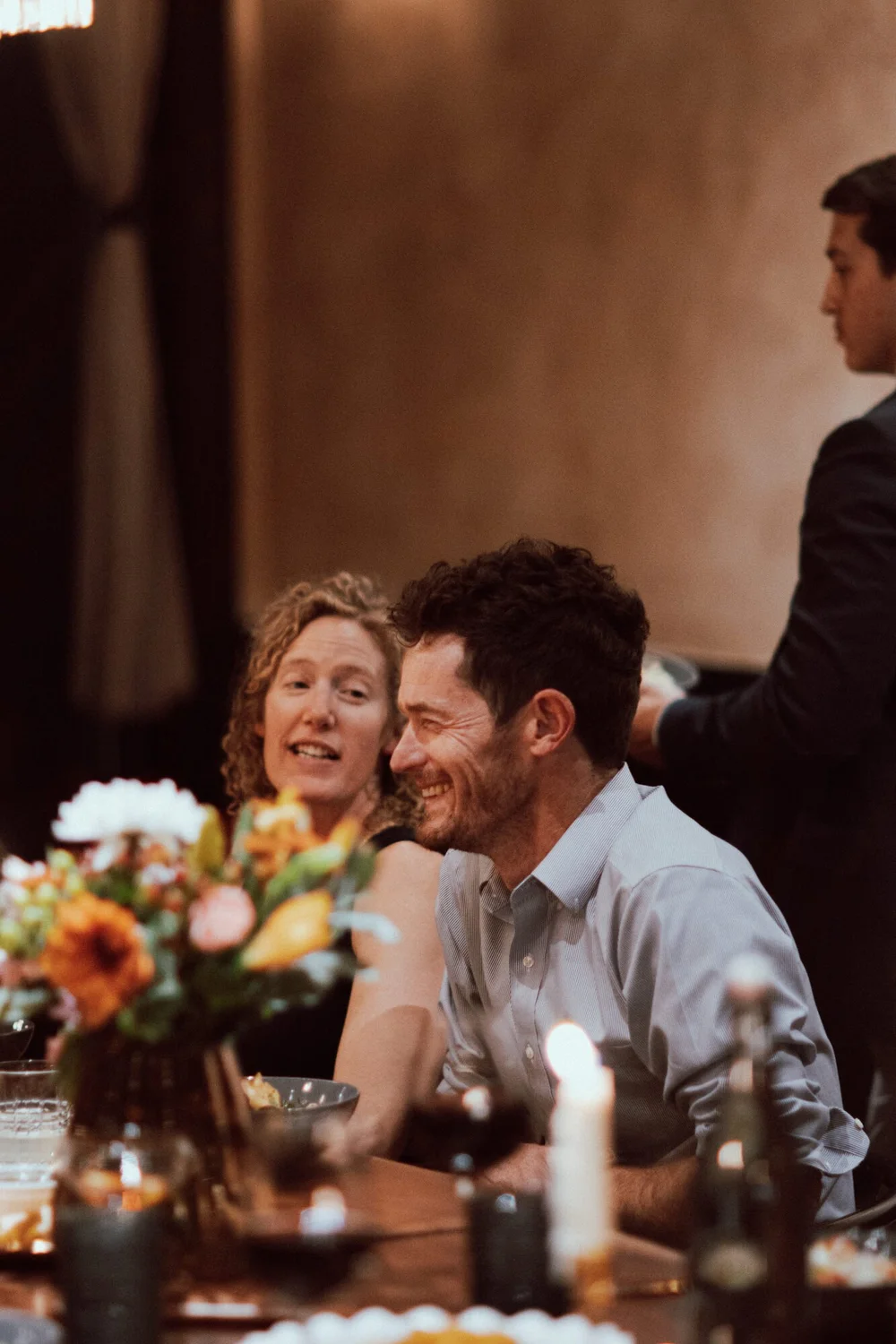 Guests laughing at the table