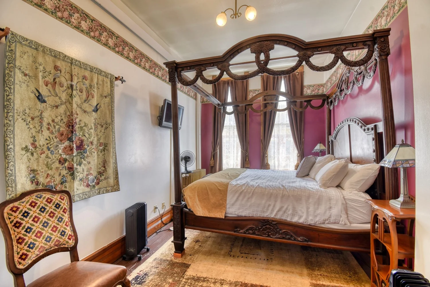 Room 316 at the Delaware Hotel, the four poster bed and the tall windows