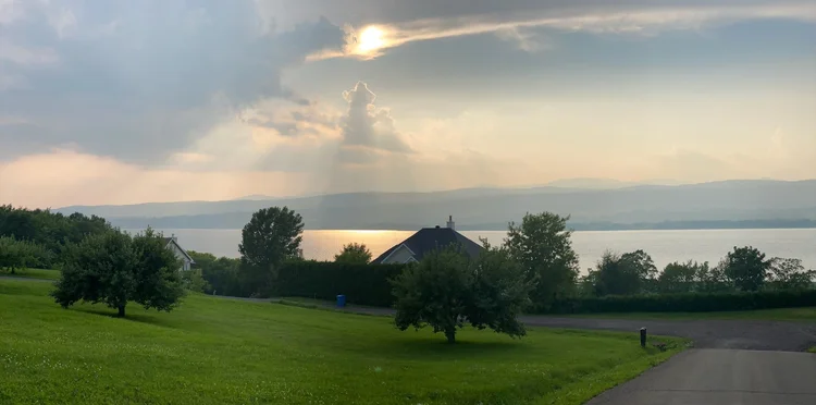 Sunbeams over the river after the cruise · Boston–Quebec City 2025