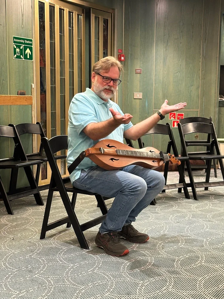 Stephen with dulcimer in hand · Boston–Quebec City 2025