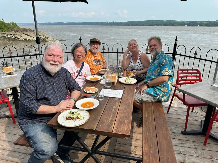 Lunch by the river after the cruise · Boston–Quebec City 2025