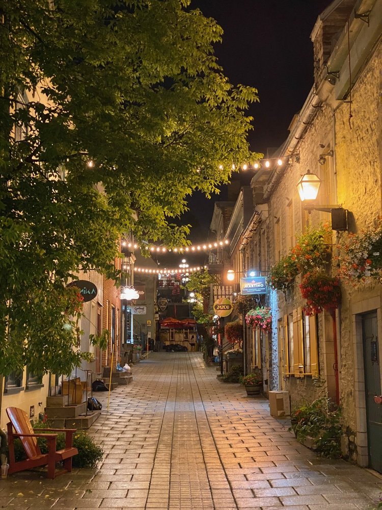 A Québec lane after dark, after the cruise · Boston–Quebec City 2025