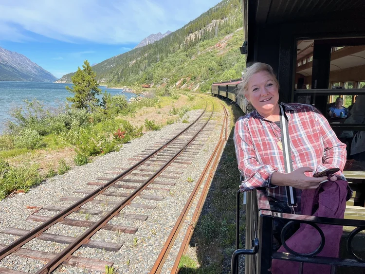 Heather on the train platform · Alaska 2026